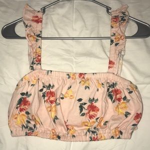 This is a very cropped floral top, size Medium